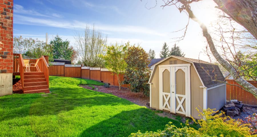 Fenced backyard with storage shed in Salt Lake City